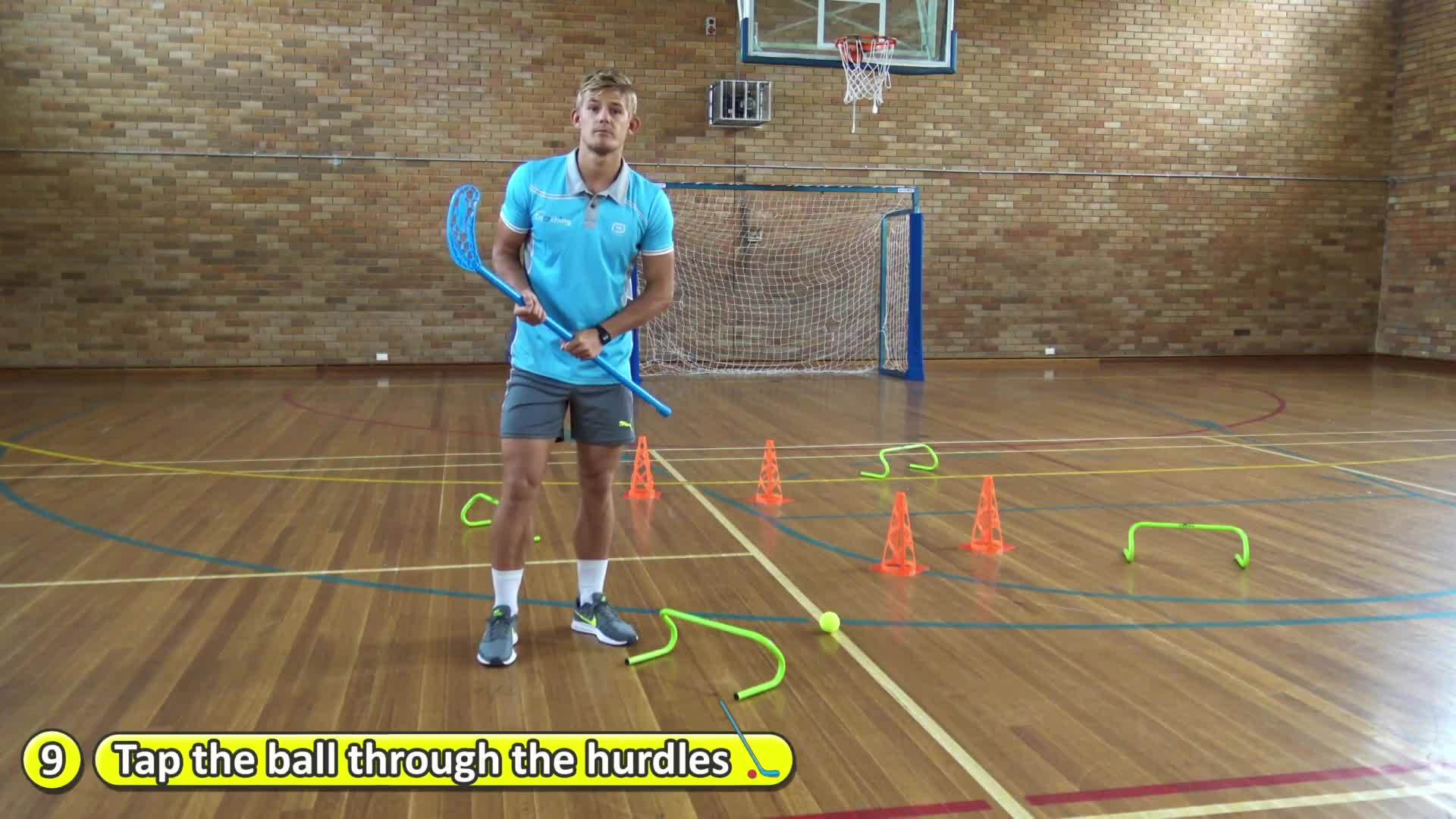 Station: Hockey › Tap the ball through the hurdles | Teaching fundamentals of PE (K-3)